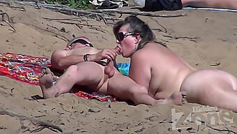 Amateur nudist gets sucked off on beach